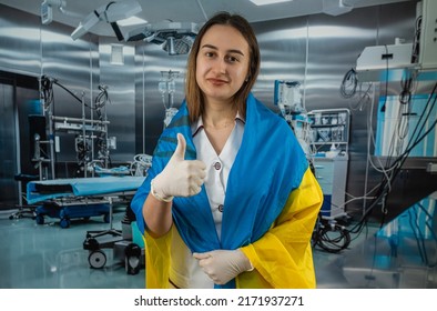 Pretty Female Surgeon Or Nurse Poses And Supports Peoples In The Ukrainian Flag During The War With Russia. Global Support For Ukraine