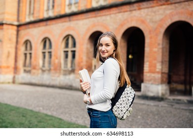 pretty female university student portrait in spring