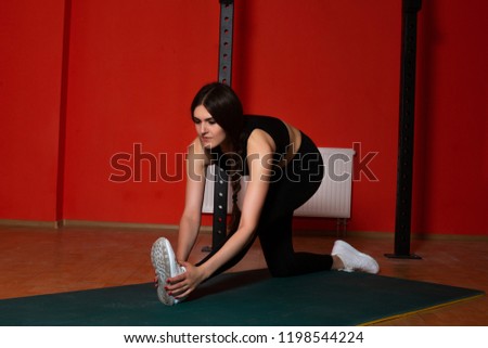 Similar – Image, Stock Photo Woman stretching on yoga mat in a yoga studio