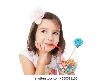 Pretty Girl Among The Sweets, Candies And Lollipops.
Funny Child With Candy Lollipop, Happy Little Girl Eating Big Sugar Lollipop, Kid Eat Sweets. Surprised Child With Candy. 