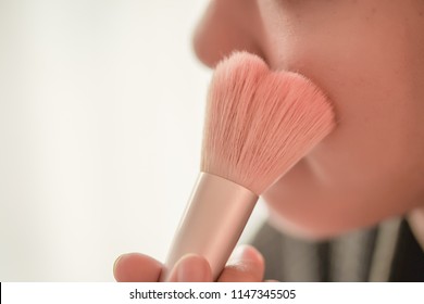 Pretty Girl Is Applying Blush On Cheek By Brush. Beauty Makeup.