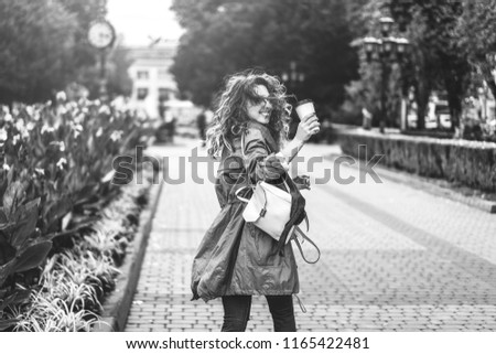 Similar – Blonde thin woman with hat and sunglasses visiting the city during the day.