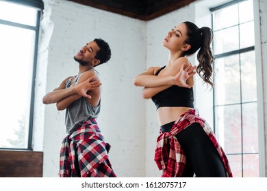 Pretty Girl And Handsome African American Man Dancing Jazz Funk