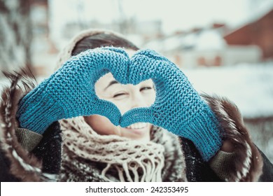 Pretty Girl With Heart Shaped Hands Is The Gloves Outdoor