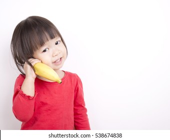 Pretty Girl Holding Banana As A Phone.