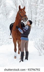 Pretty Girl And Horse In The Winter Fores