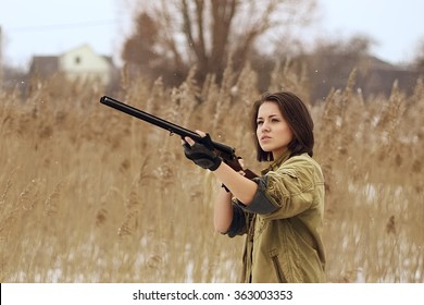 pretty girl with hunting rifle