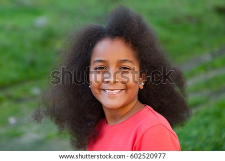 Similar – Cute African American girl smiling in the street with afro hair