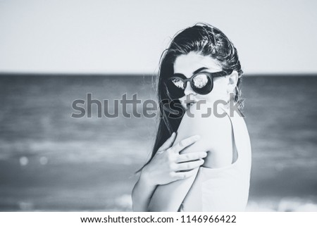 Similar – Young surfer woman with top and bikini kissing surfboard