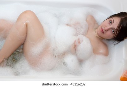 Pretty girl is lying  in the bath