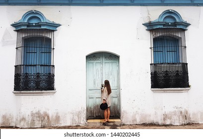 Pretty Girl Openning Door In A Old Vintage House In A Central America Town