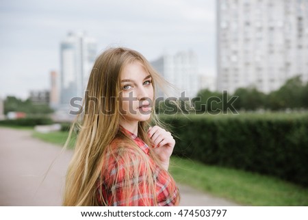 pretty girl portrait outdoor on the high-rise city background
