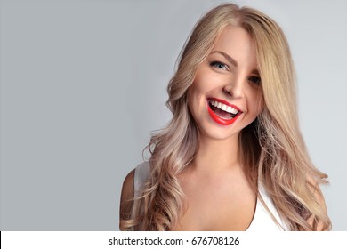 Pretty Girl With Red Lips And Professional Make Up And White Teeth Smile