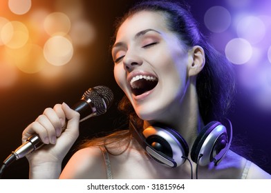 pretty girl singing at the revelry party - Shutterstock ID 31815964