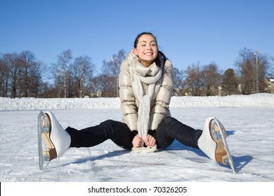 Pretty Girl Sitting On Ice