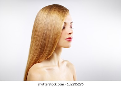 Pretty girl with straight hair on a gray background - Shutterstock ID 182235296