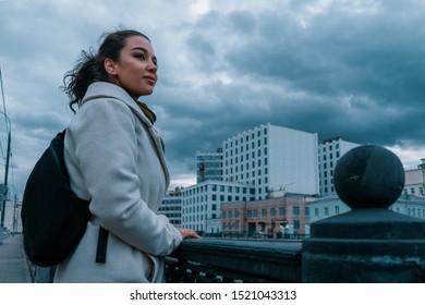 Pretty Girl Strolling At Cloudy Autumn Day. Photo Looks Like Film Frame Or Movie Screenshot