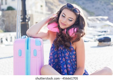 Pretty Girl Waiting For Cruise With Neck Pillow