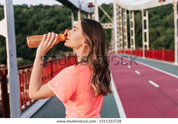 Pretty Girl Wavy Hair Drinking Water Stock Photo Edit Now 1311333728