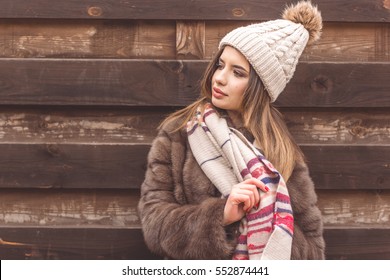 Pretty girl is wearing warm hat and scarf