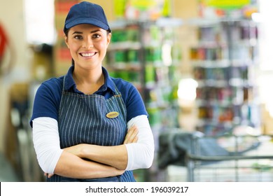 Pretty Hardware Store Employee Looking At The Camera