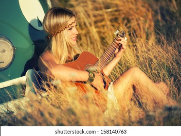 Pretty Hippie Girl Playing Guitar