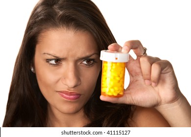 Pretty Hispanic Woman Reading Label On Prescription Medication