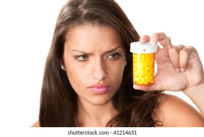 Pretty Hispanic Woman Reading Label On Prescription Medication