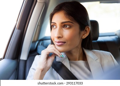 Pretty Indian Business Executive Daydreaming In A Car