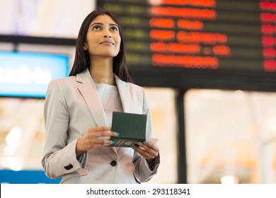 Pretty Indian Business Woman Checking Flight Information At Airport