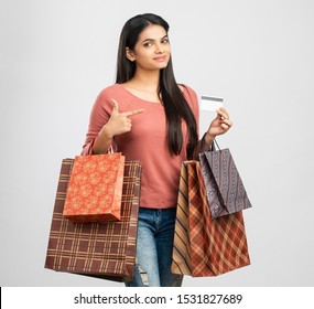 Pretty Indian Girl With Shopping Bags With Credit Card.