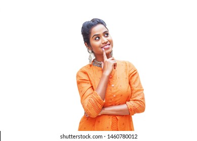 Pretty Indian Woman In Kurta Thinking And Looking Up Over White Background