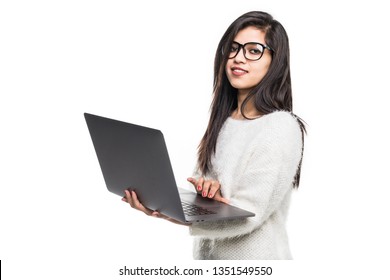 Pretty Indian Young College Girl With Bag Using Laptop Standing Against White Background