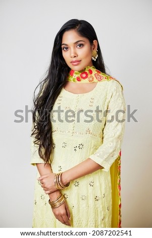 Pretty Indian young woman  on white background.