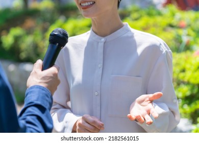 Pretty Japanese Woman Interviewed Outside