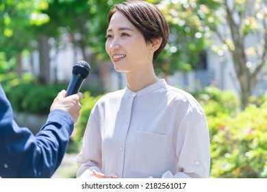 Pretty Japanese Woman Interviewed Outside