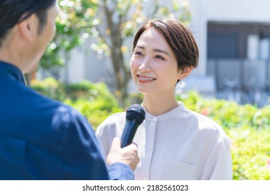 Pretty Japanese Woman Interviewed Outside