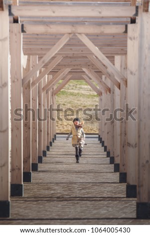 Similar – Image, Stock Photo Little girl climbing to a wooden observation tower in a wetland