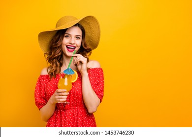 Pretty lady holding fresh beverage hand enjoy sunny day wear off-shoulders dress isolated yellow background