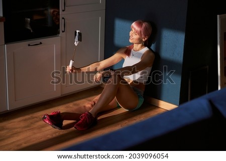 Similar – Mother hugging her baby in front of fireplace