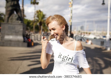 Pretty  laughing blonde girl on the Barcelona streets