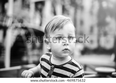 Similar – Image, Stock Photo Little cute boy looking at camera and sticking out his tongue