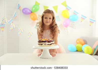 Pretty Little Girl With Birthday Cake At Home