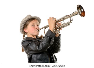 a pretty little girl with a black jacket and hat plays the trumpet