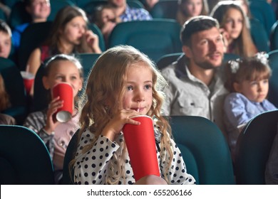 Pretty Little Girl Drinking Coke Sitting At The Movie Theatre Enjoying Watching Cartoon Copyspace Happiness Positivity People Leisure Children Child Kids Kid Cuteness Innocence Entertainment Activity.