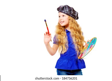 Pretty Little Girl Painter Posing With A Brush And Palette. Isolated Over White.