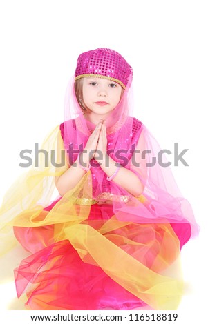pretty little girl sitting in the costume of the eastern beauty