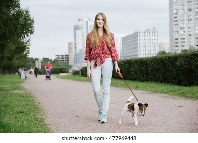 Pretty Long Hair Girl Walking Her Dog On A Leash,