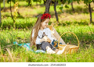 Pretty long haired little girl is inspecting ripe grapes. Wine harvest concept. - Powered by Shutterstock