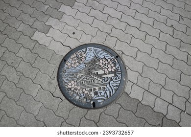 Pretty Manhole Cover in Osaka, Japan With 港区 Means Minato District